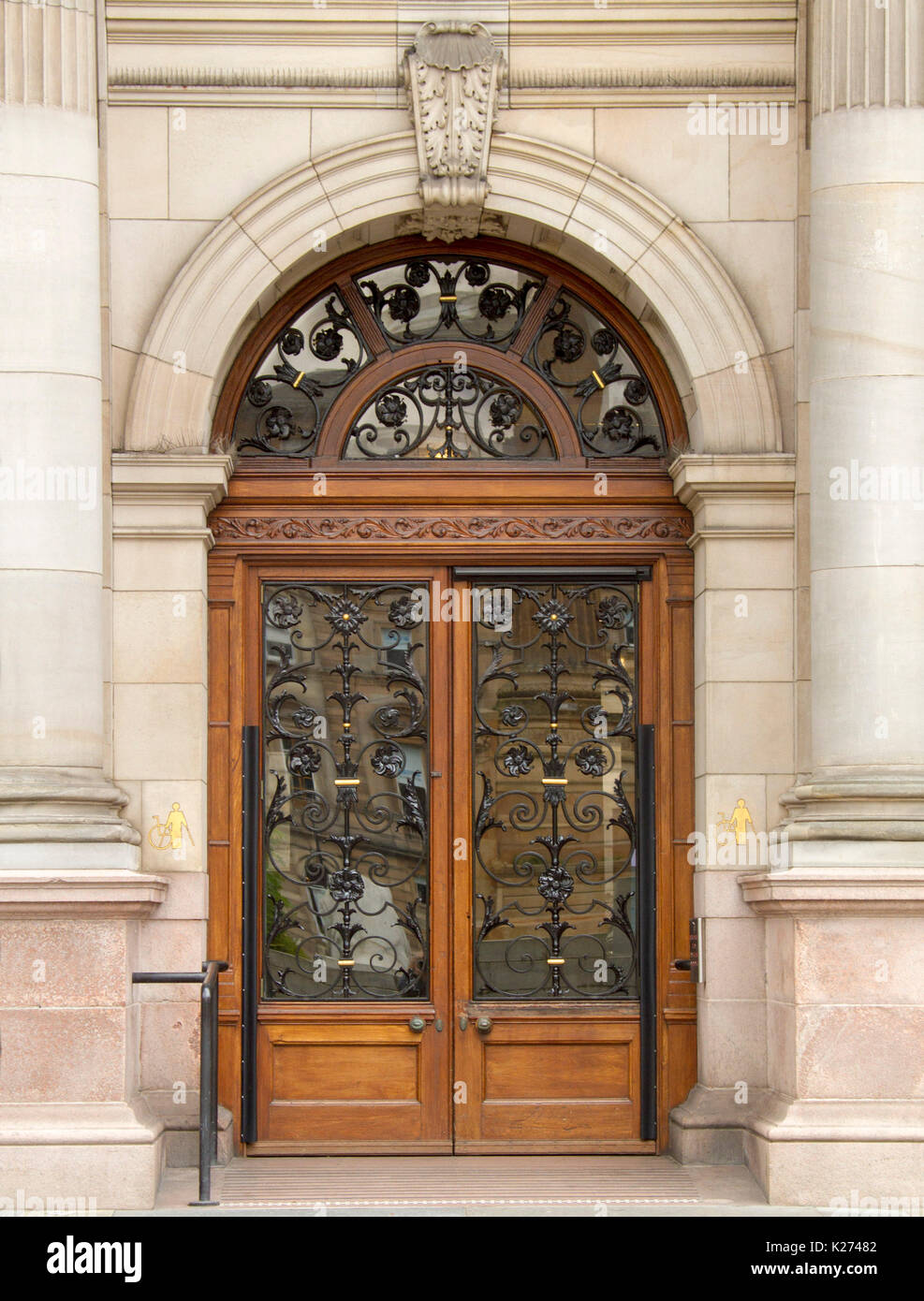 Stunning entrance / arched door of Glasgow City Chambers / town hall with decorative wrought iron design over glass panels, in Scotland Stock Photo
