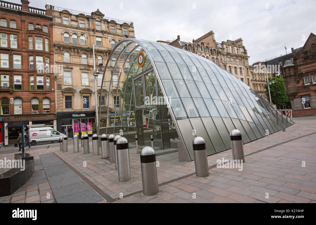 Modern domed glass entrance to St Enoch subway surrounded by buildings of a past age in city of Glasgow, Scotland Stock Photo