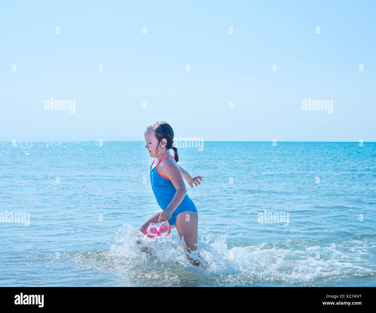 little girl playing in the sea Stock Photo - Alamy