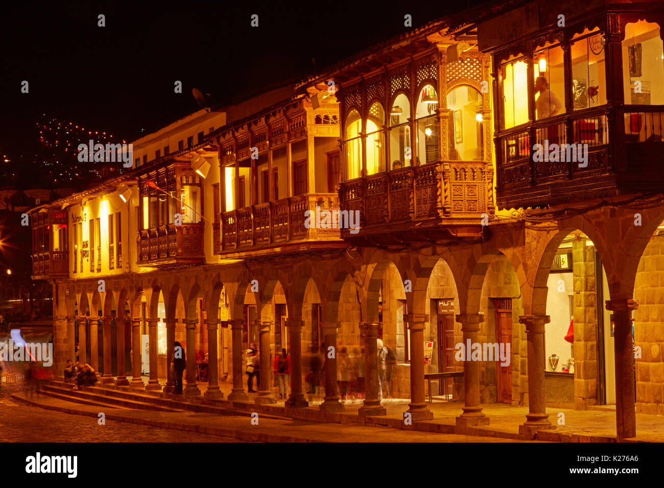 Restaurants and shops around Plaza de Armas at dusk, Cusco, Peru, South America Stock Photo