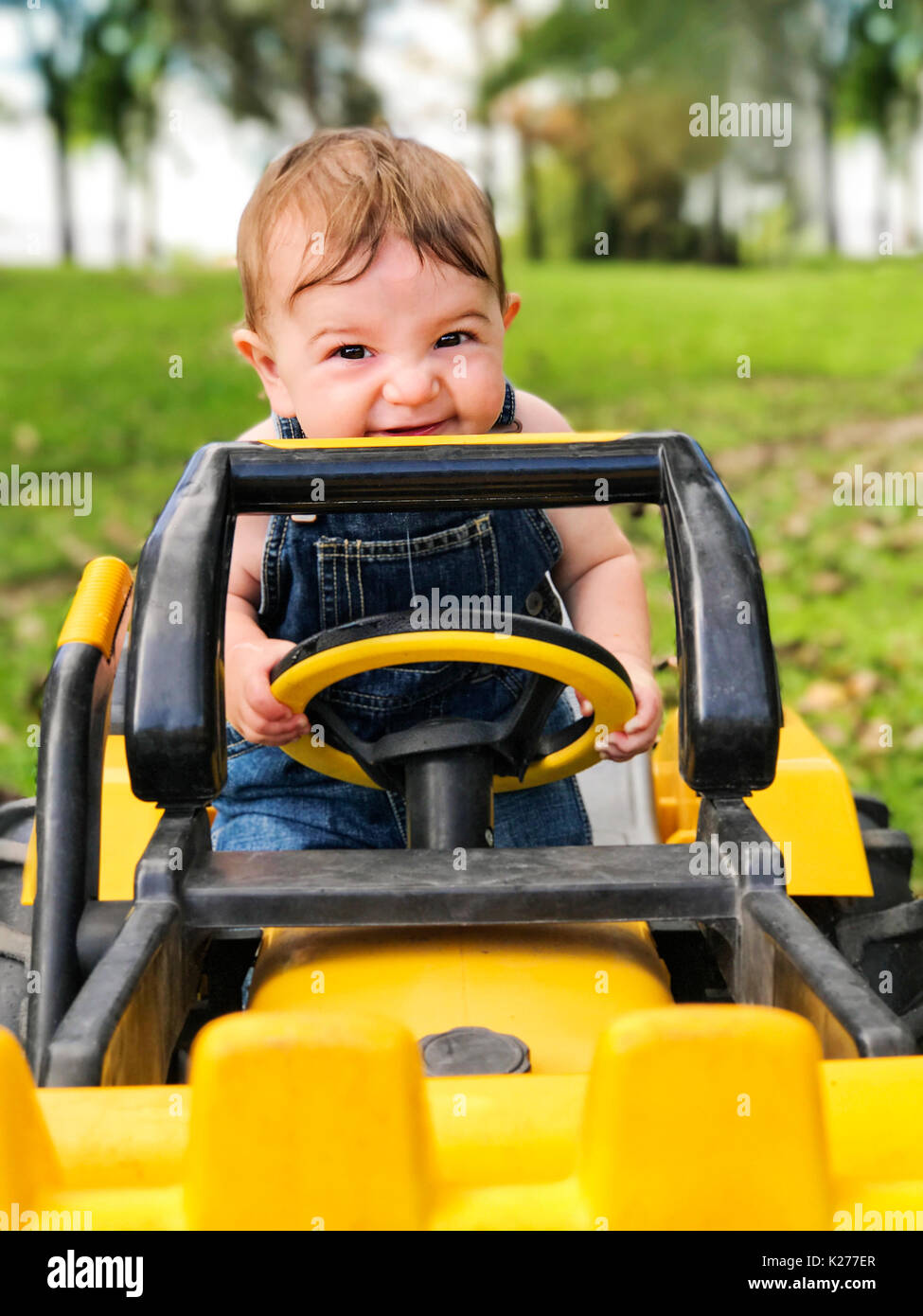 baby boy on tractor Stock Photo