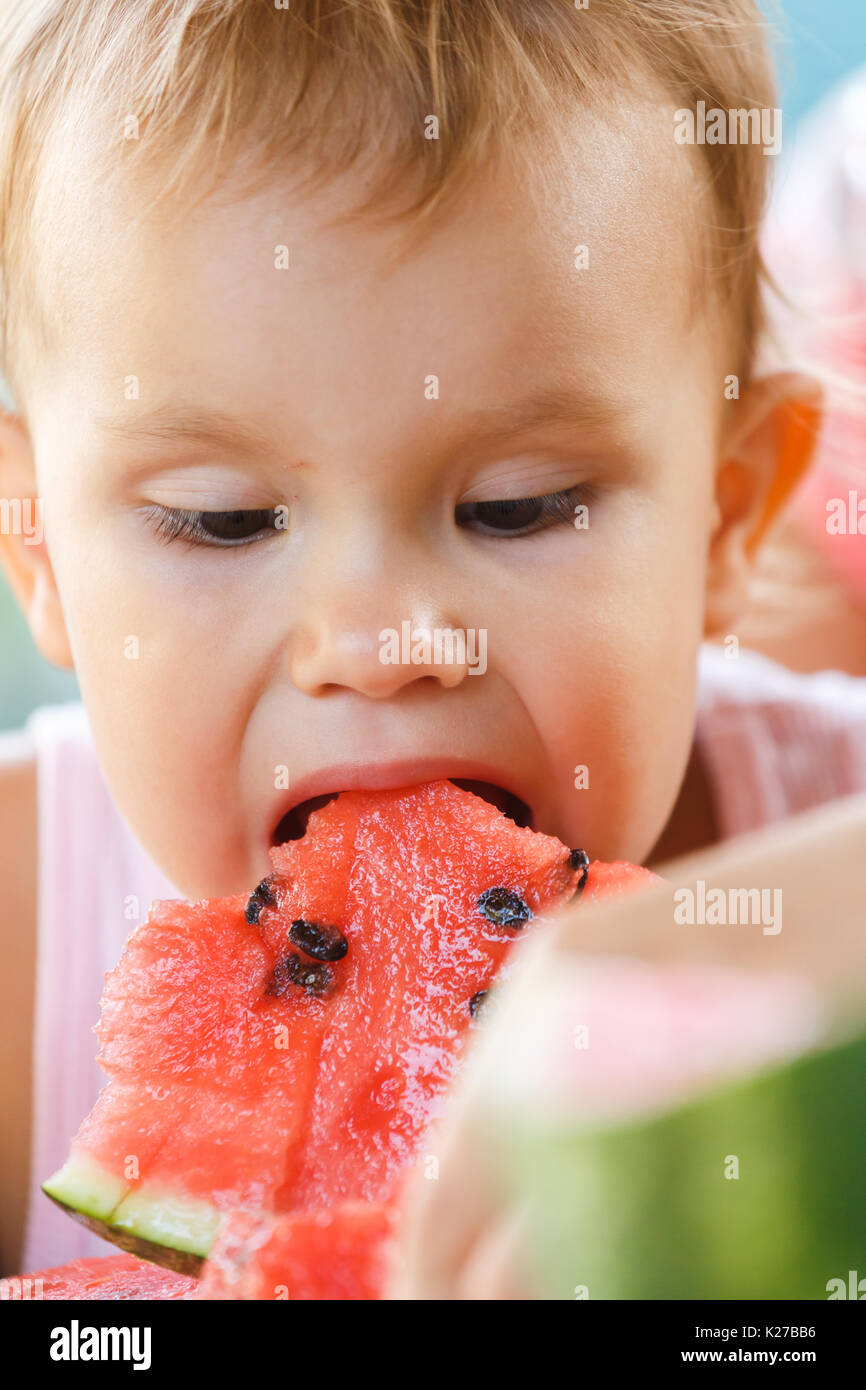 Child eating watermelon Stock Photo Alamy