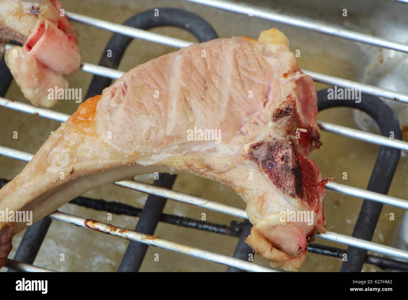 Lamb chops on the rack of an electric barbecue during summer Stock Photo