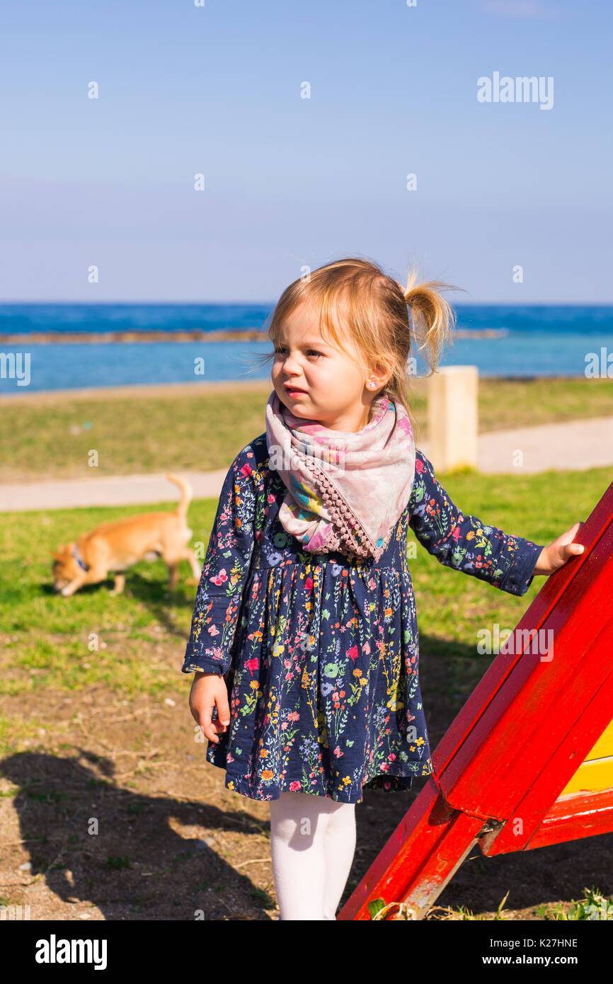 Portrait of beautiful young girl on the playground Stock Photo - Alamy