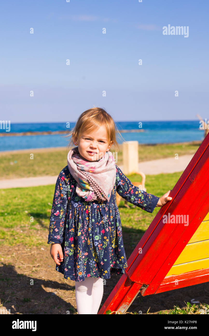 Portrait of beautiful young girl on the playground Stock Photo - Alamy