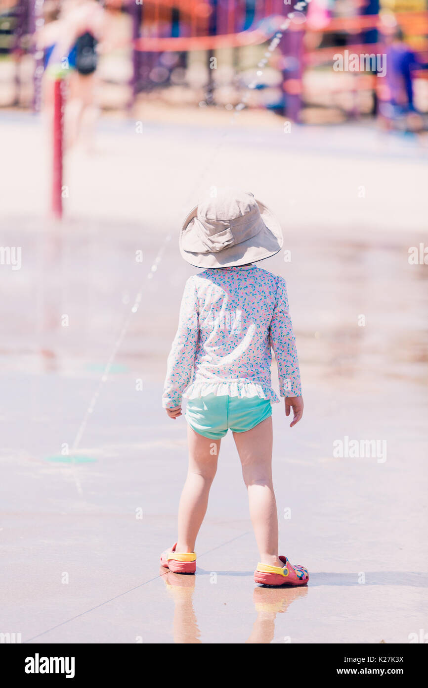 Little girl playing on the playground in the Summer Stock Photo - Alamy