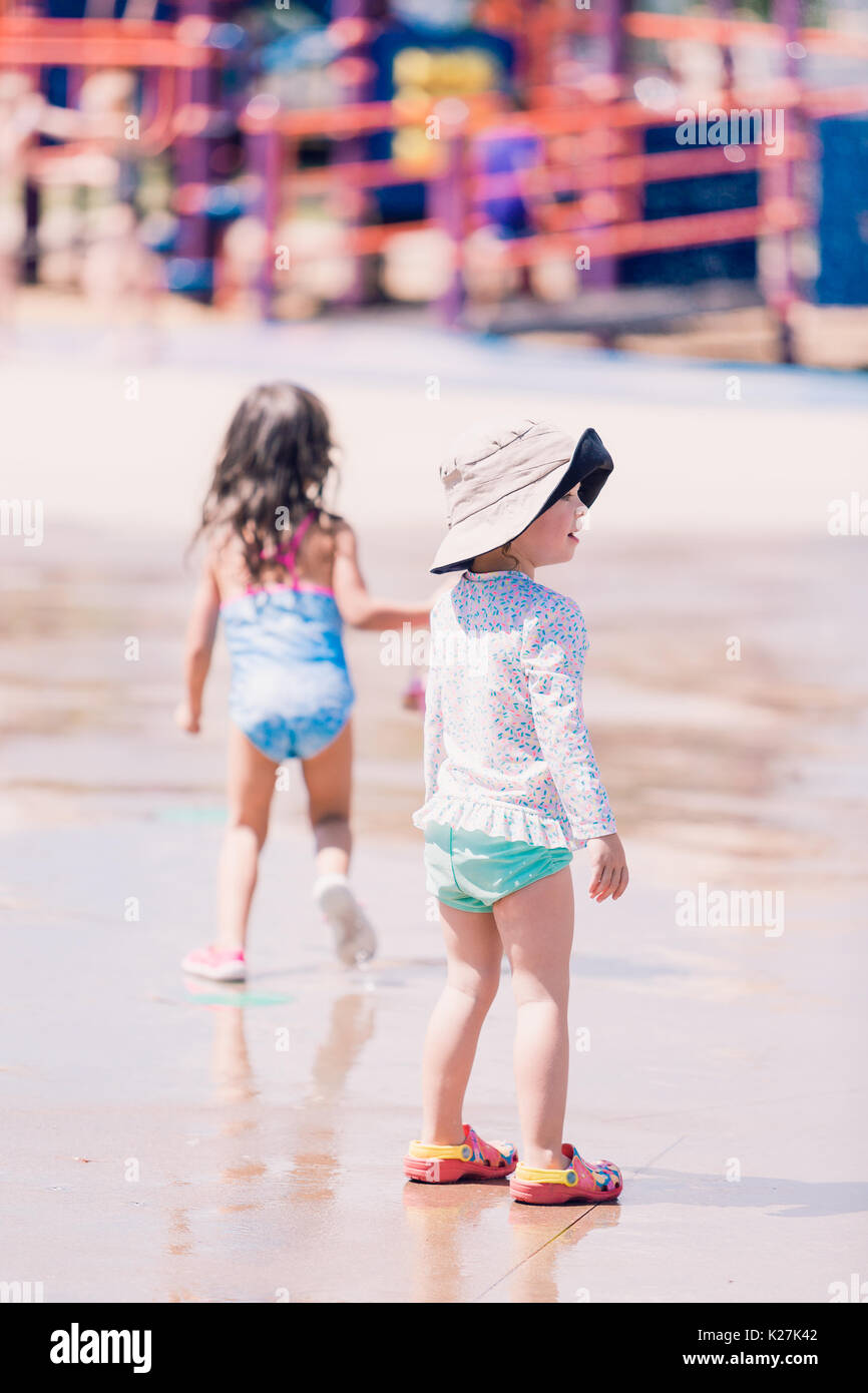 Little girl playing on the playground in the Summer Stock Photo - Alamy