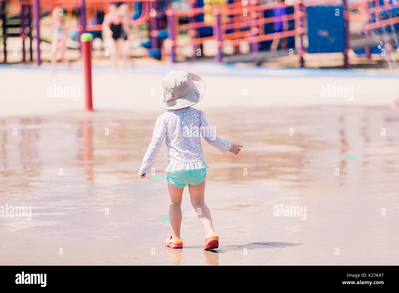 Little girl playing on the playground in the Summer Stock Photo - Alamy