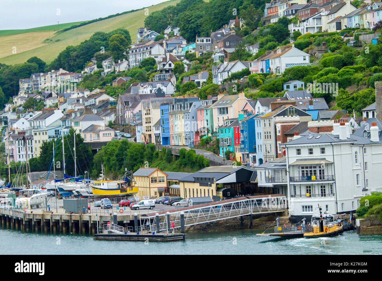 Coastal town of Dartmouth with brightly coloured houses crammed on tree