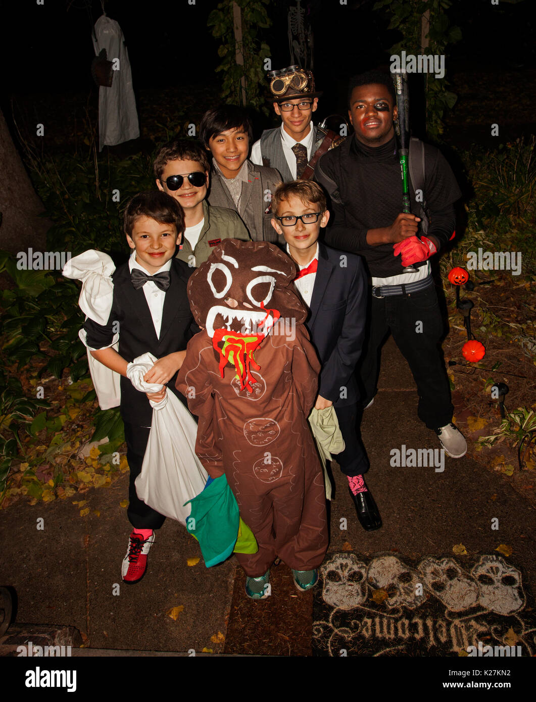 Halloween teenage trick or treaters dressed in various costumes. St Paul Minnesota MN USA Stock