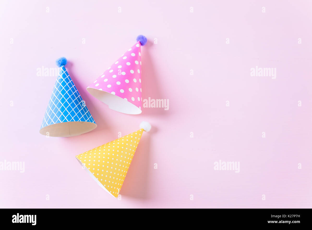 Colorful party hats for kids Birthday Party on pink background Stock ...
