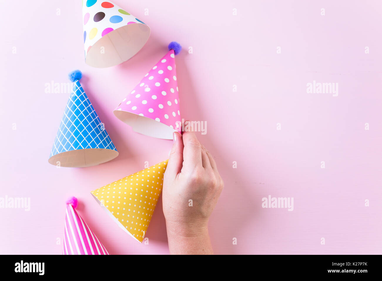 Colorful party hats for kids Birthday Party on pink background Stock ...