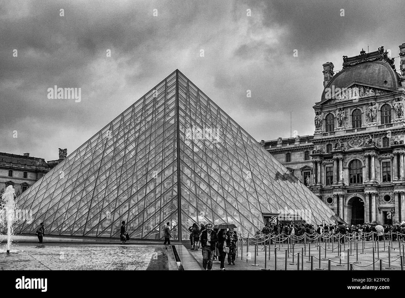 Interior and exterior photographs of The Louvre, including art, crowds, and symmetry in architecture on Sept 17, 2016. Stock Photo
