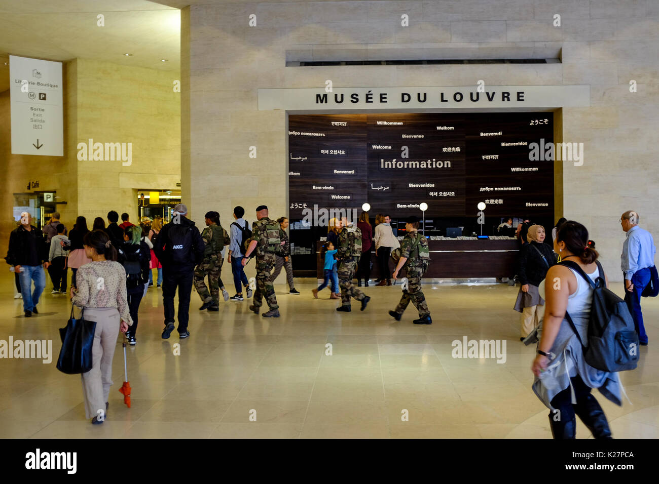 Security forces armed with weapons walk through the Louvre Museum in Paris, France on September 17, 2016. Security has been heightened in recent years. Stock Photo