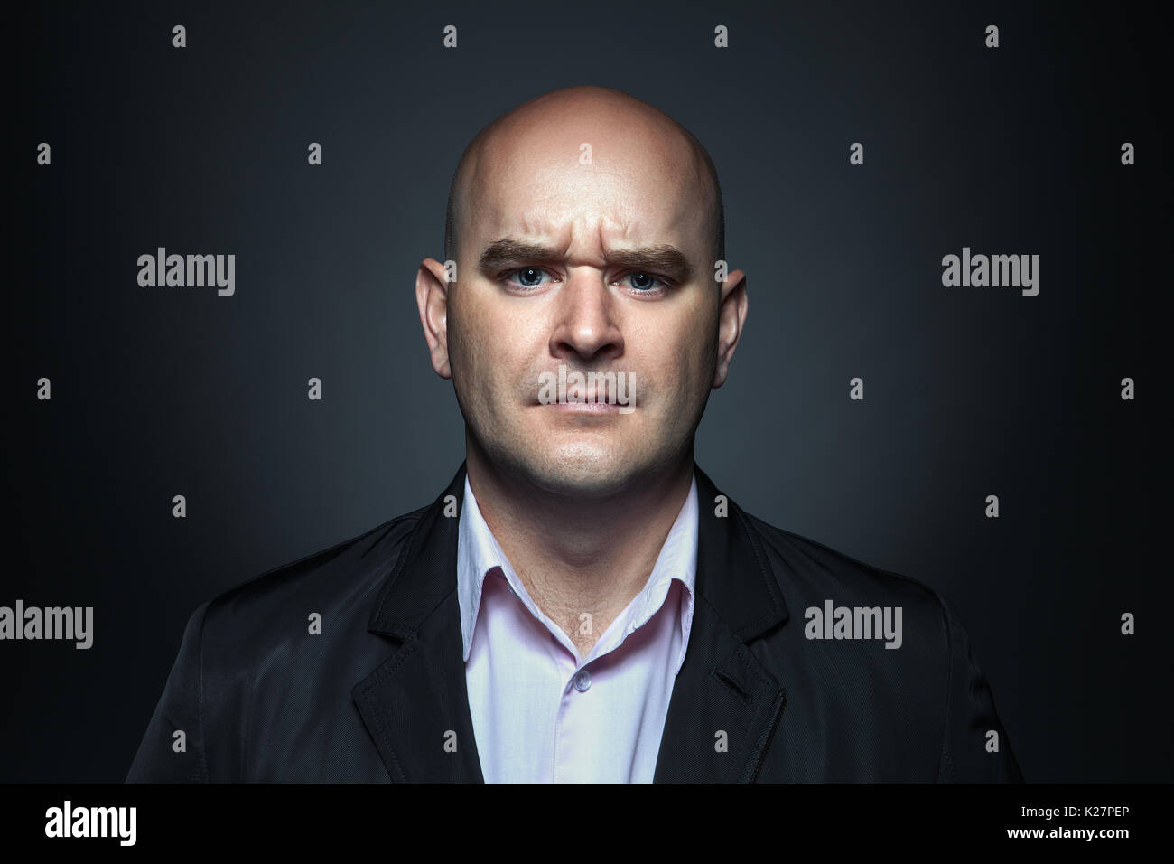 Portrait of a man with angry expression Stock Photo