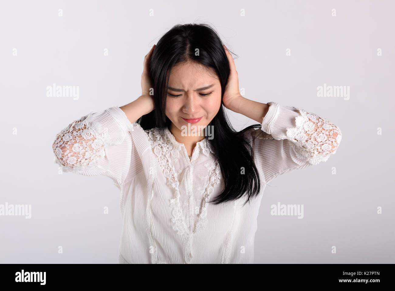 Young asian woman crying isolated hi-res stock photography and images ...