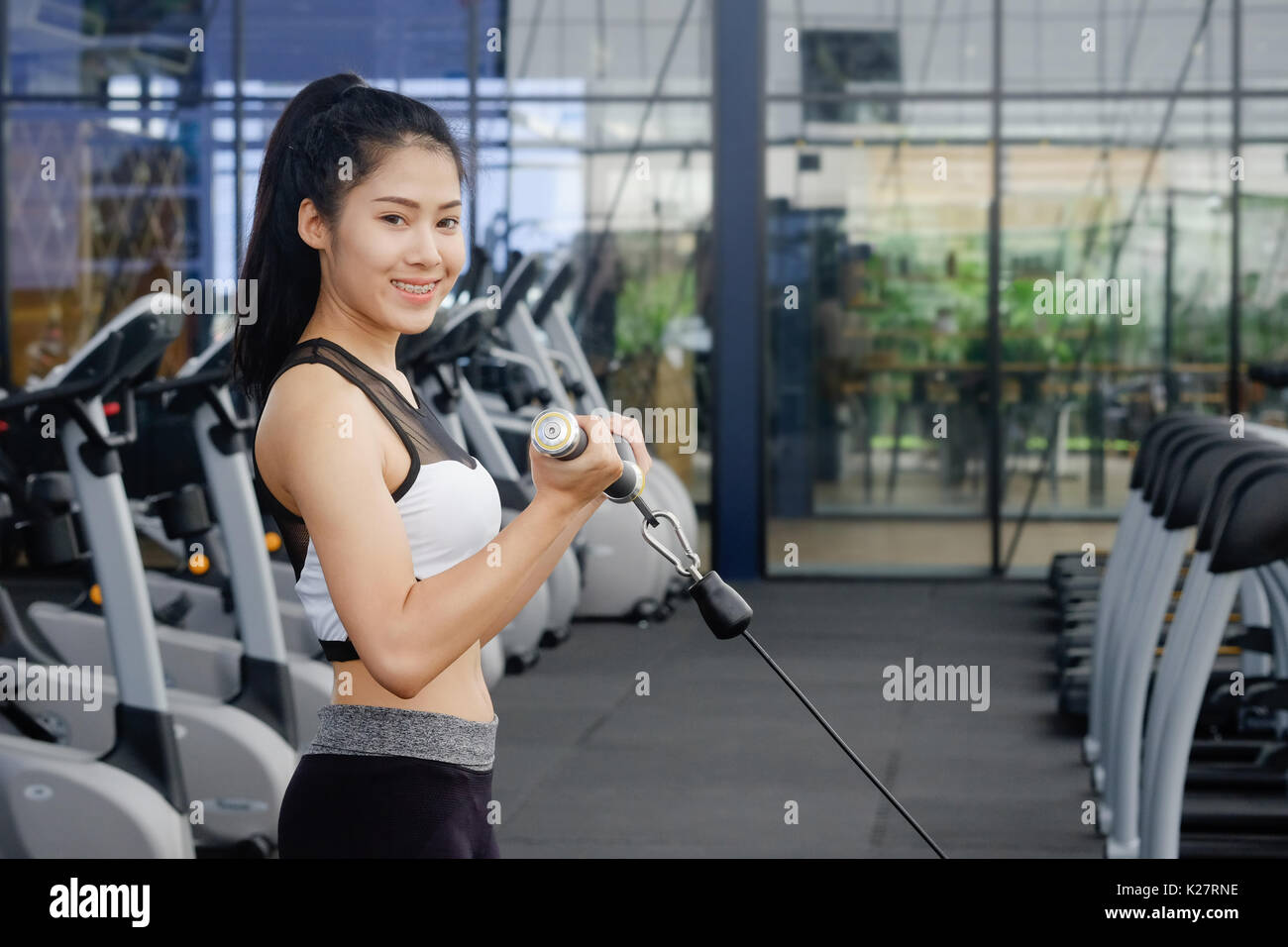 Asian woman workout body builder in sport fitness gym Stock Photo - Alamy