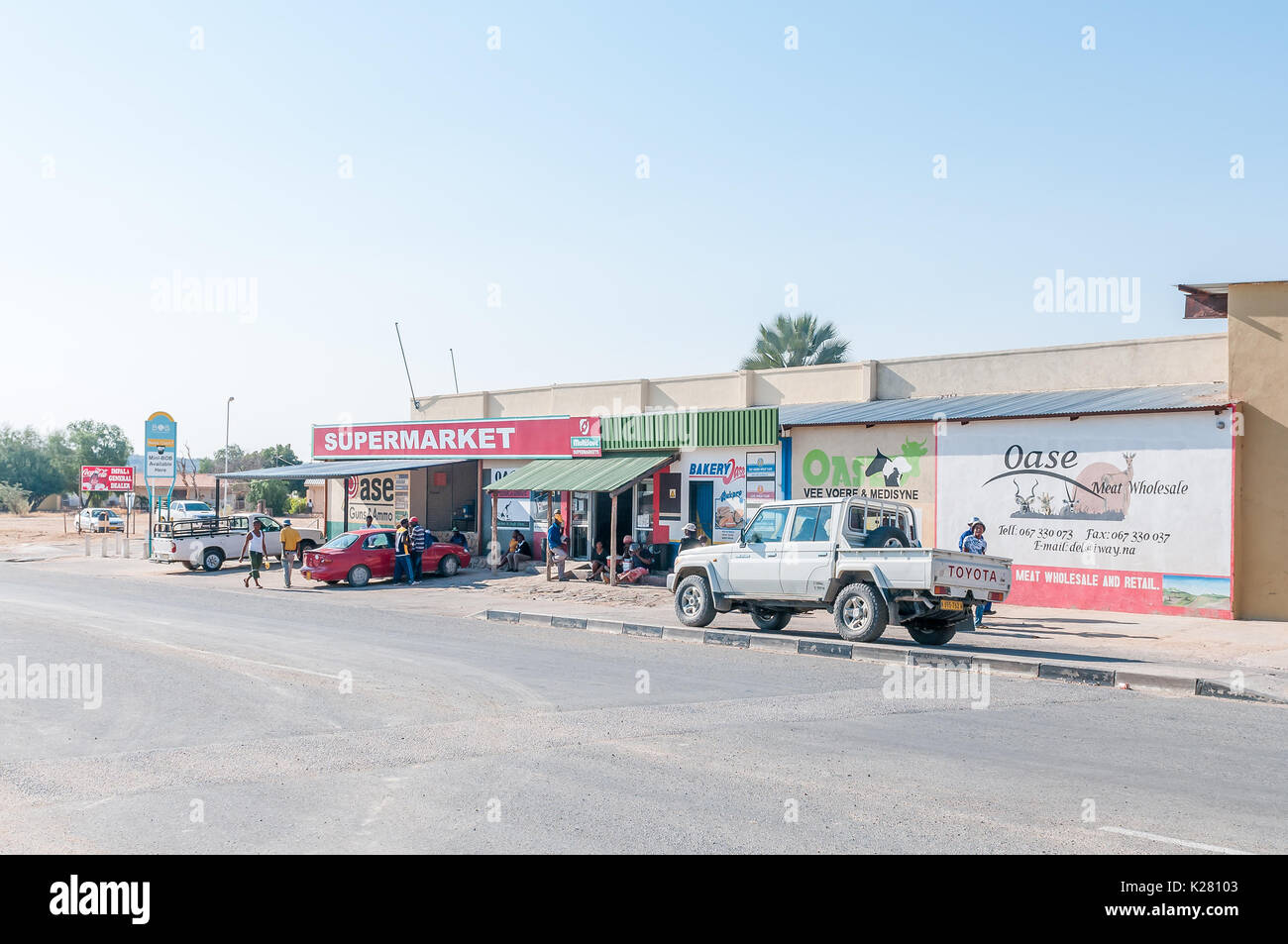 KAMANJAB, NAMIBIA - JUNE 27, 2017: A street scene with businesses and vehicles in Kamanjab, a small town in the Kunene Region of Namibia Stock Photo