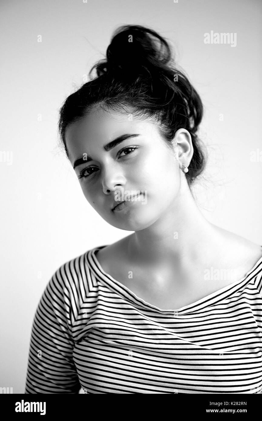 Portrait of young beautiful girl with brown eyes and black hair.Natural beauty,with clean glowing skin., black and white Stock Photo