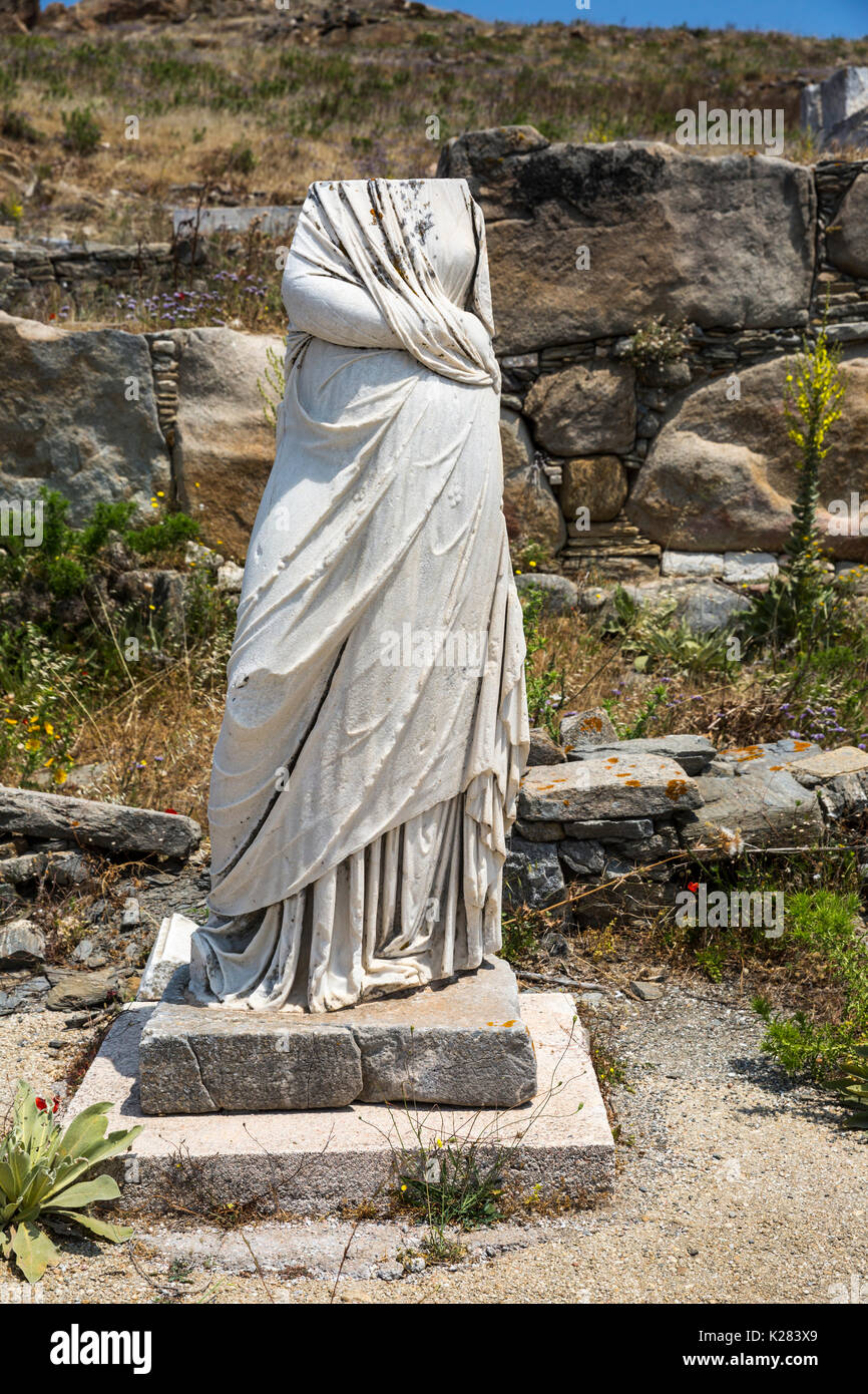 Headless statue standing amidst the ruins of Delos, Cyclades, Greece. Stock Photo