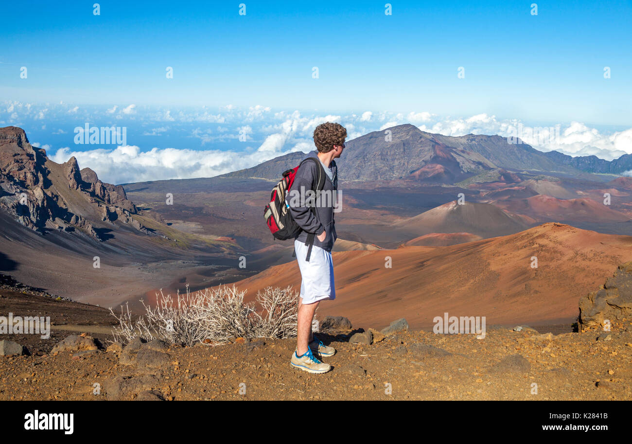 Teenager hikes on the Sliding Sands Trail  in Haleakala National Park on Maui Stock Photo