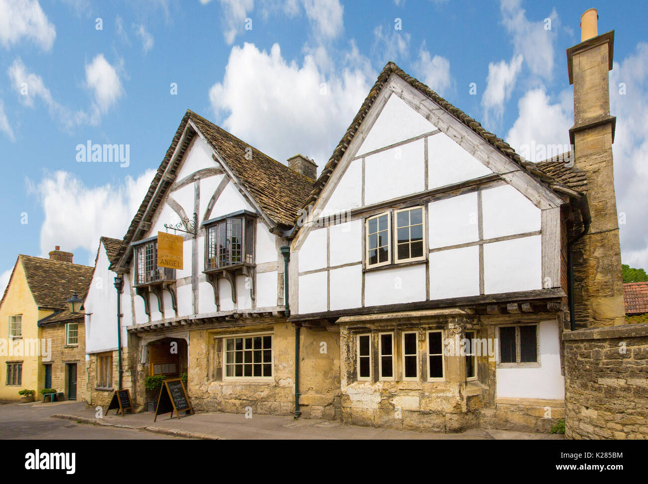 Historic house under blue sky in village of Lacock, Wiltshire, England Stock Photo