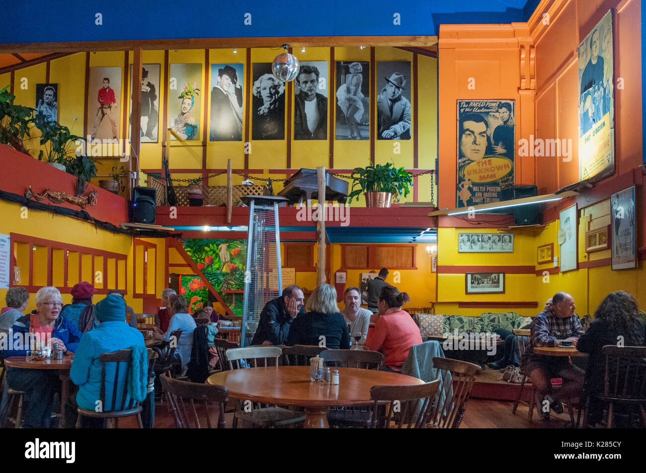 The busy Wholemeal Cafe in the former theatre (1910) in Takaka, New Zealand, The surrounding Golden Bay district is a hub of alternative lifestyles. Stock Photo