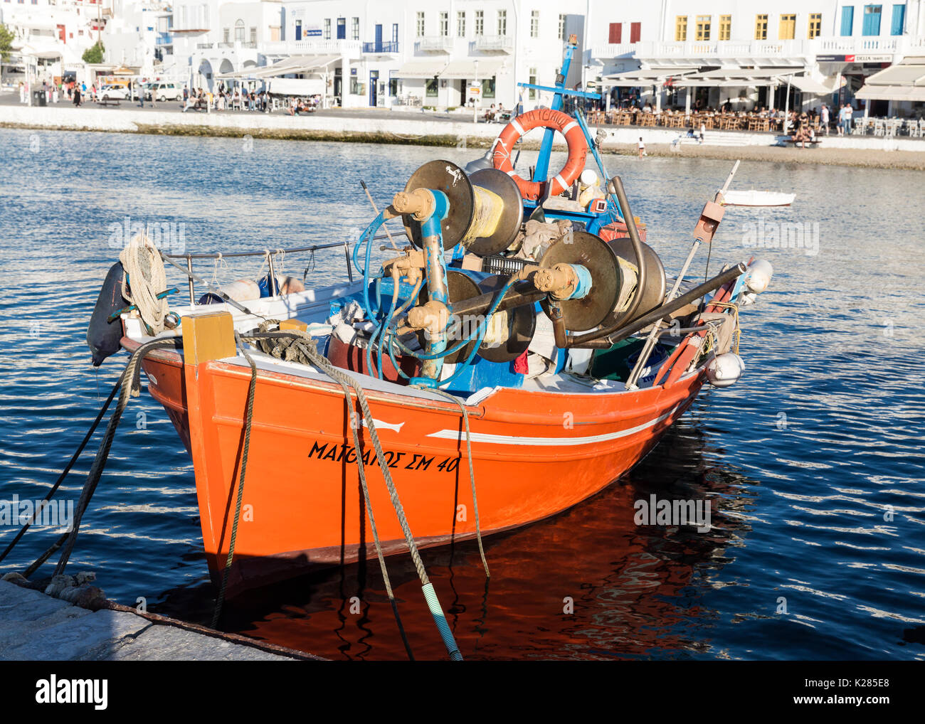 Traditional fishing boat tied up at the harbour, Old Port, Mykonos, Greece. Stock Photo