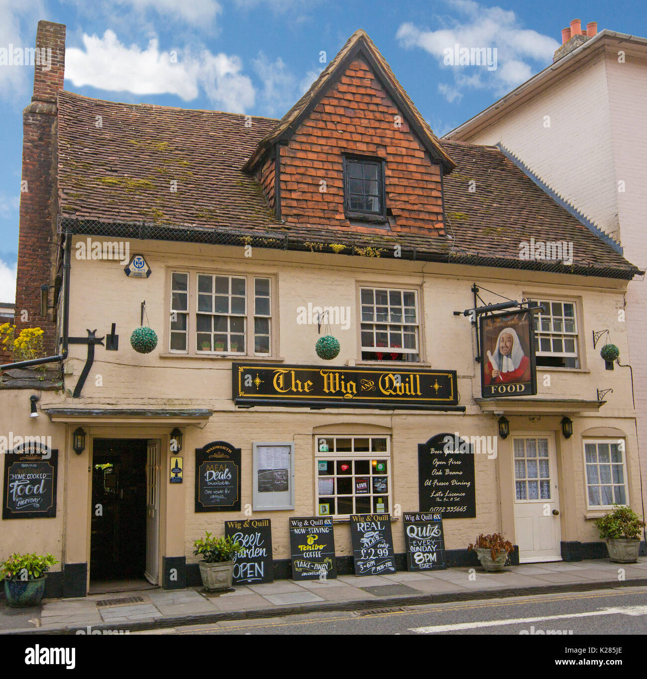 The Wig and Quill, an historic 14th century pub under blue sky in Salisbury, Wiltshire, England Stock Photo