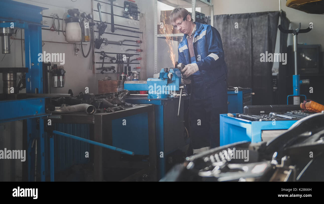 Car auto grinding metal construction in sparks of Stock