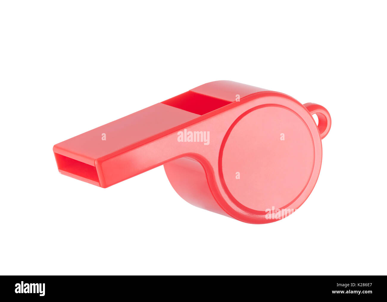 Red plastic whistle on a white background with clipping path Stock Photo