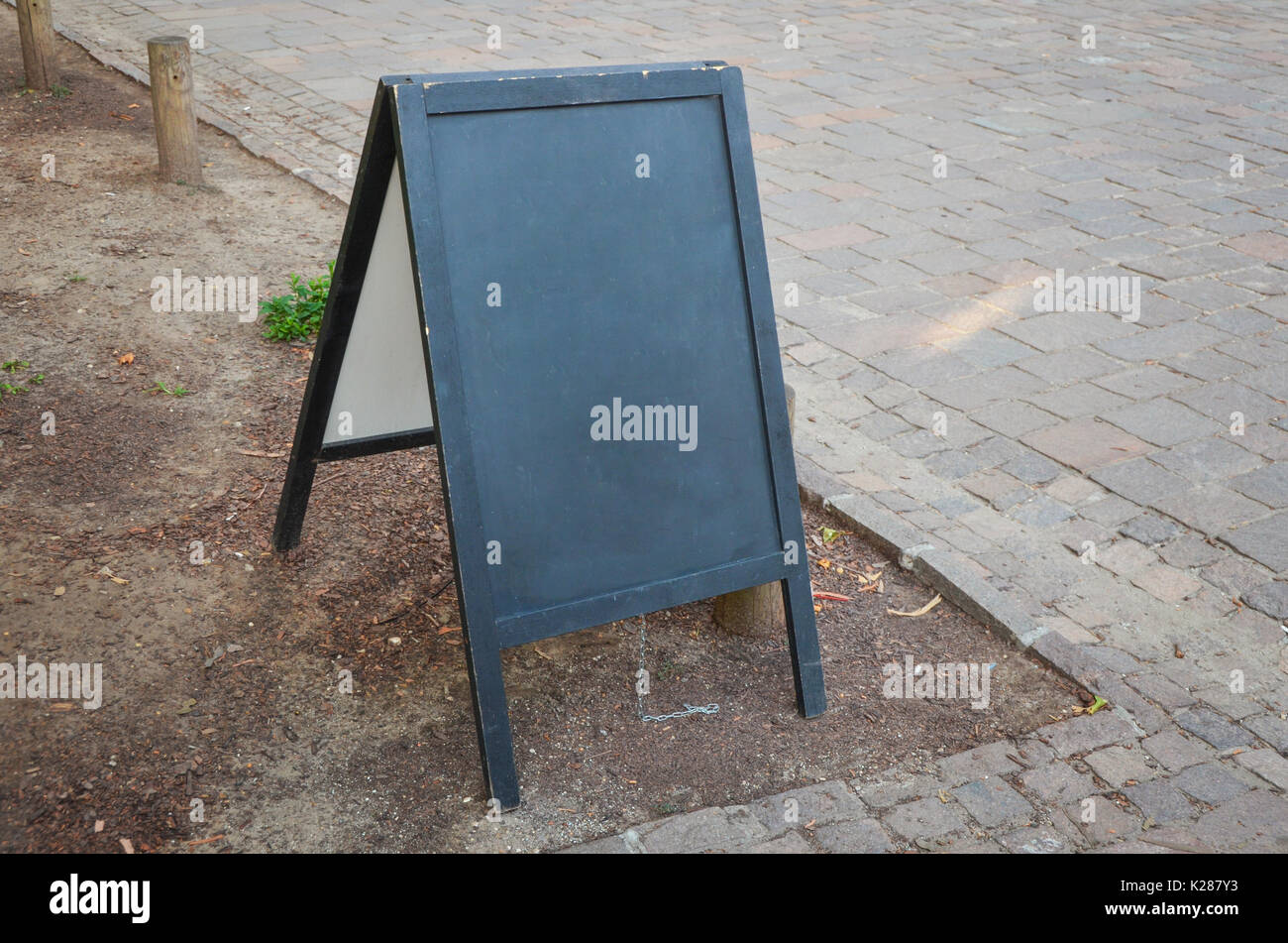 Black chalkboard stand mockup for logo, branding or daily menu promotion. Stock Photo