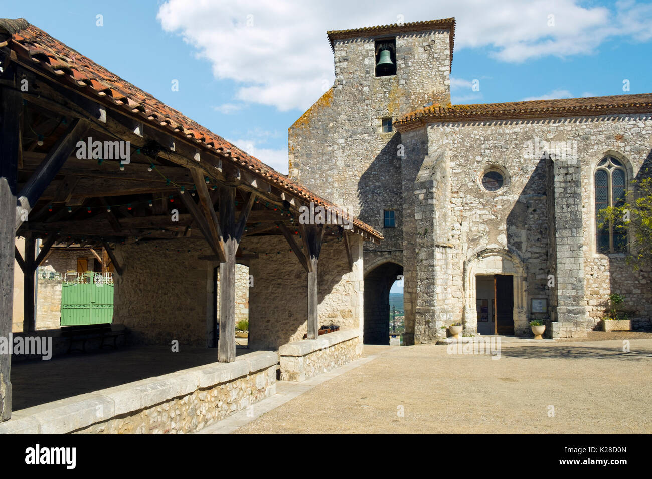 Market hall and church in spring sunshine in Pujols, Lot-et-Garonne, France. Stock Photo