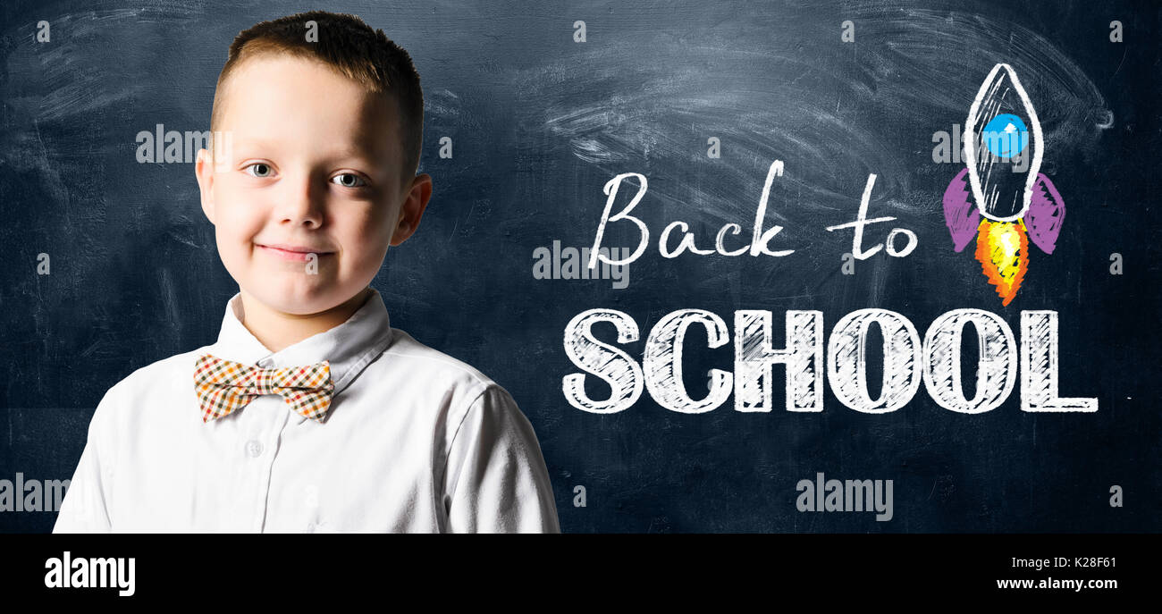 Boy standing blackboard hi-res stock photography and images - Alamy