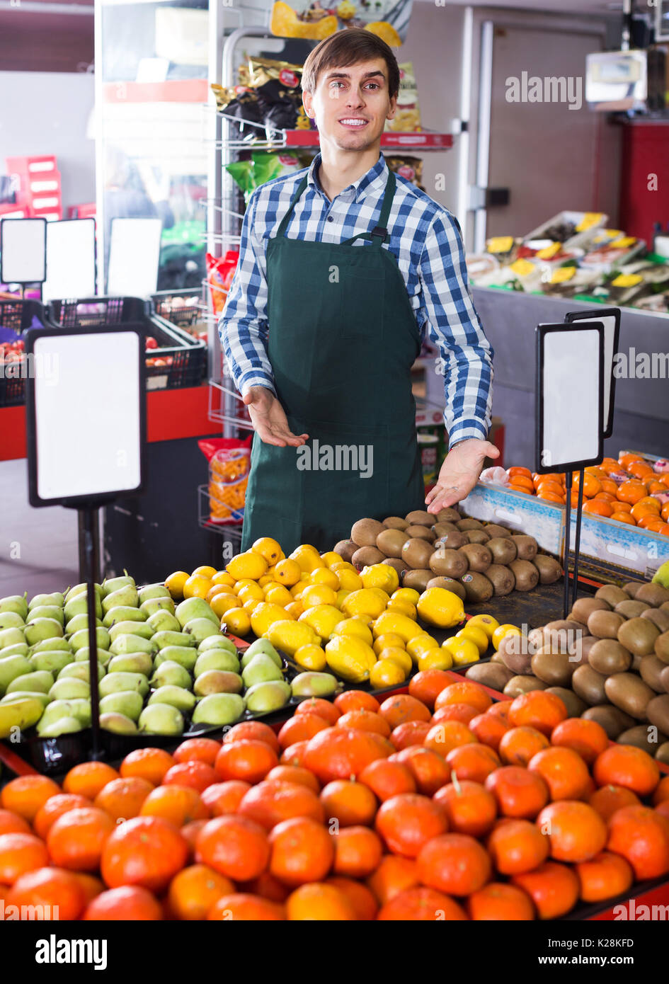 Young positive grocery worker hi-res stock photography and images - Alamy