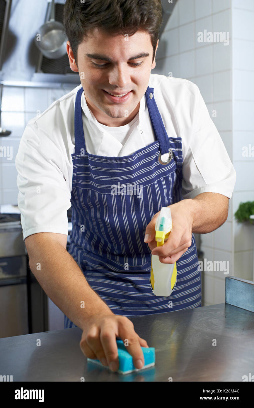 Worker In Restaurant Kitchen Cleaning Down After Service Stock Photo ...