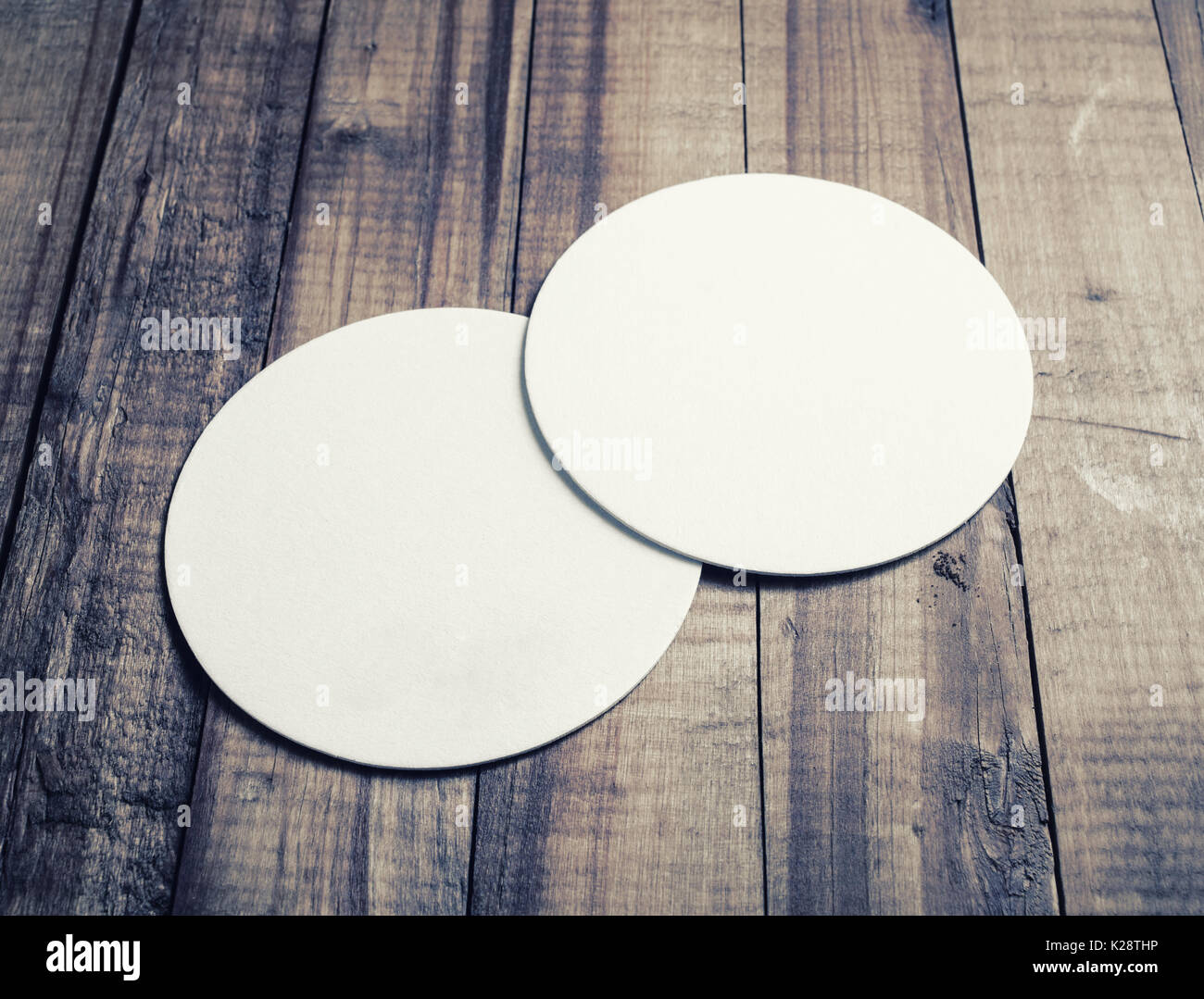 Two blank white beer coasters on vintage wooden table background Stock  Photo - Alamy