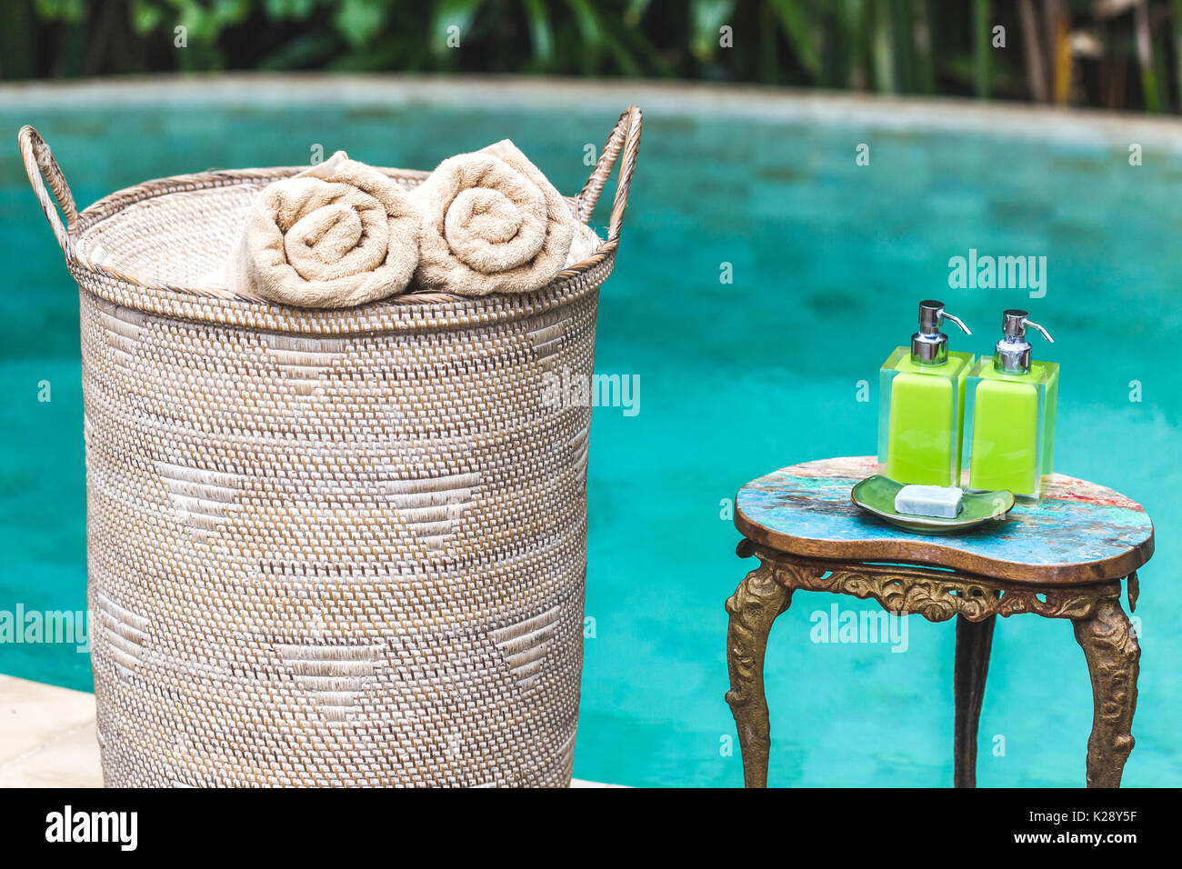 Bottle of shower gel and wicker basket with shells on sink in bathroom  Stock Photo - Alamy
