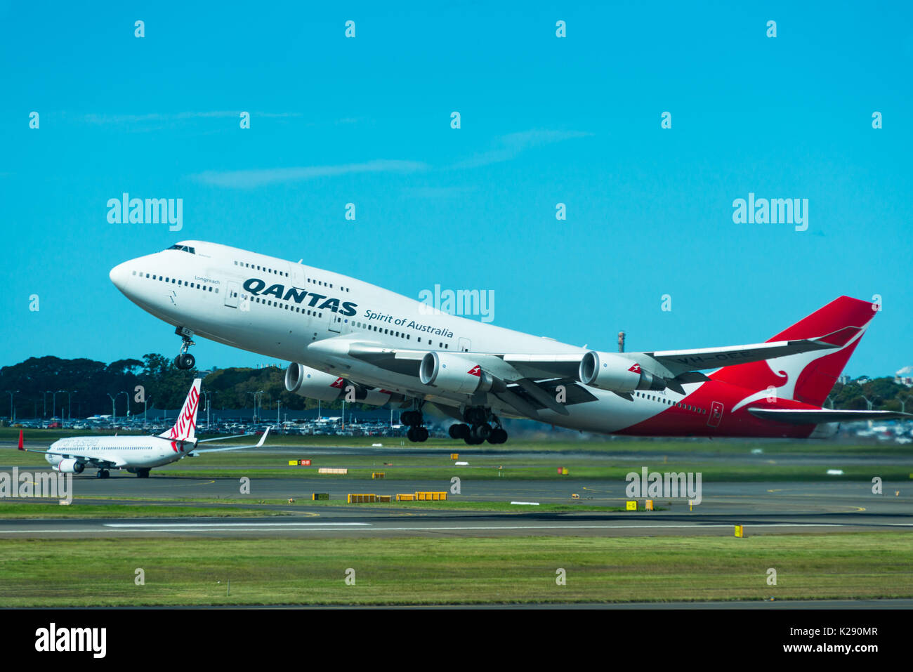Qantas 747 jumbo jet taking off at Sydney International Airport, New South Wales, Australia. Stock Photo