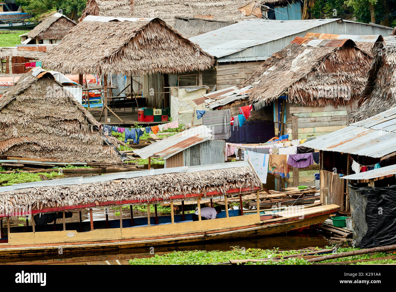 Floating houses in Iquitos, Peru. The traditional thatched roofed