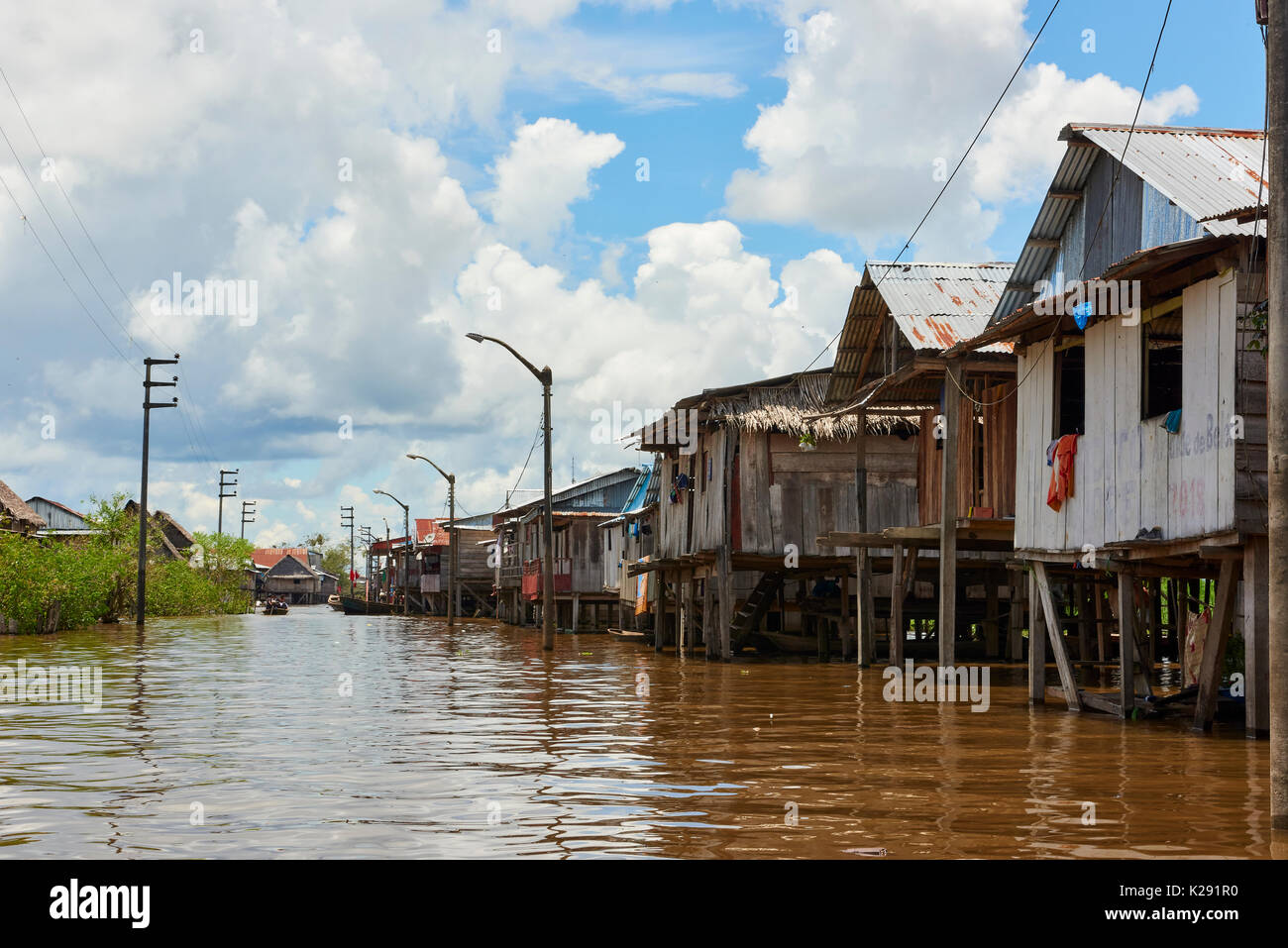 Wooden houses on sticks in flooded area of Belem, Iquitos, Peru. The district is poor and populated by indigenous people who moved to the city. Stock Photo