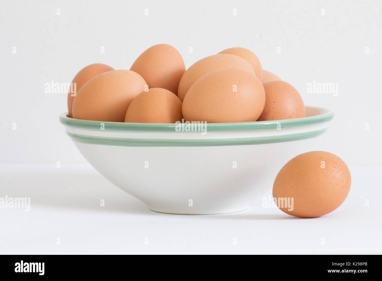 eggs in white bowl on white background Stock Photo