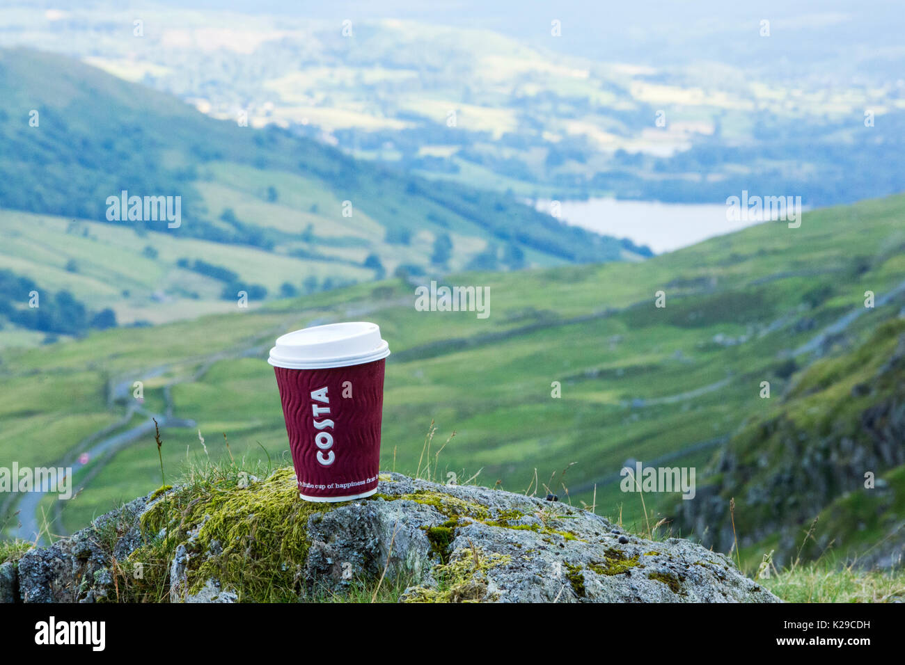 A Costa takeaway coffee cup discarded by some brainless idiot, half way up Red Screes in the Lake District, UK. Stock Photo