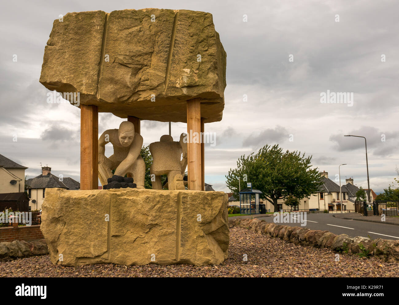 Sandstone monument on site of coal mine air shaft by sculptor Gardner Molloy, a memorial to 200 dead miners, Prestonpans, East Lothian, Scotland, UK Stock Photo