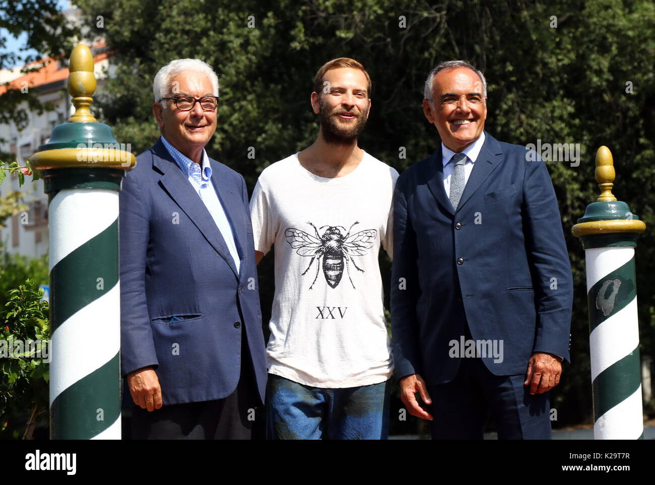 Venice, Italy. 29th August, 2017. The italian actor Alessandro Borghi (C) will host the opening and closing ceremony poses with Paolo Baratta (L), President of la Biennale di Venezia and Director of the Venice Film Festival Alberto Barbera (R) during the 74th Venice International Film Festival in Venice Lido, Italy, 29 August 2017.(will run from August 30th to September 9th) Credit: Andrea Spinelli/Alamy Live News Stock Photo