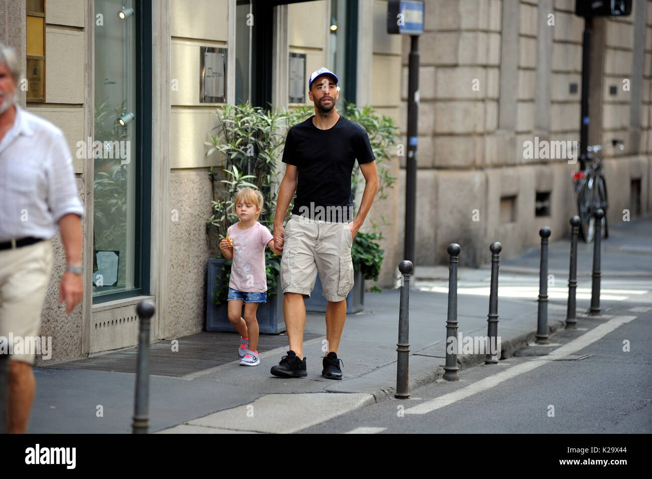 Milan, Borja Valero with her daughter in the center for the first time to know Milan The new purchase of INTER, the Spanish BORJA VALERO, bought by FIORENTINA, arrives for the first time in the center. Taking advantage of the championship stop, Borja Valero brings with her little daughter LUCIA around the city, and after walking all over the quadrilateral, she makes shopping in the 'Rinascente' in Corso Vittorio Emanuele. Stock Photo