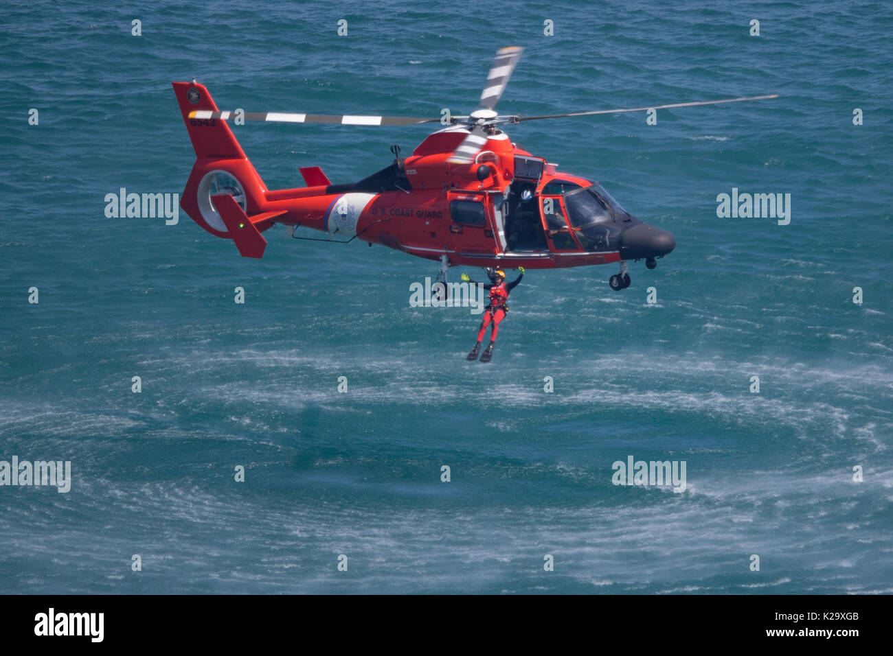August 19, 2017: Chicago, Illinois, U.S. - U.S. Coast Guard Helicopter MH-65 Dolphin performs over Lake Michigan during the 2017 Chicago Air and Water Show in Chicago, IL. Stock Photo