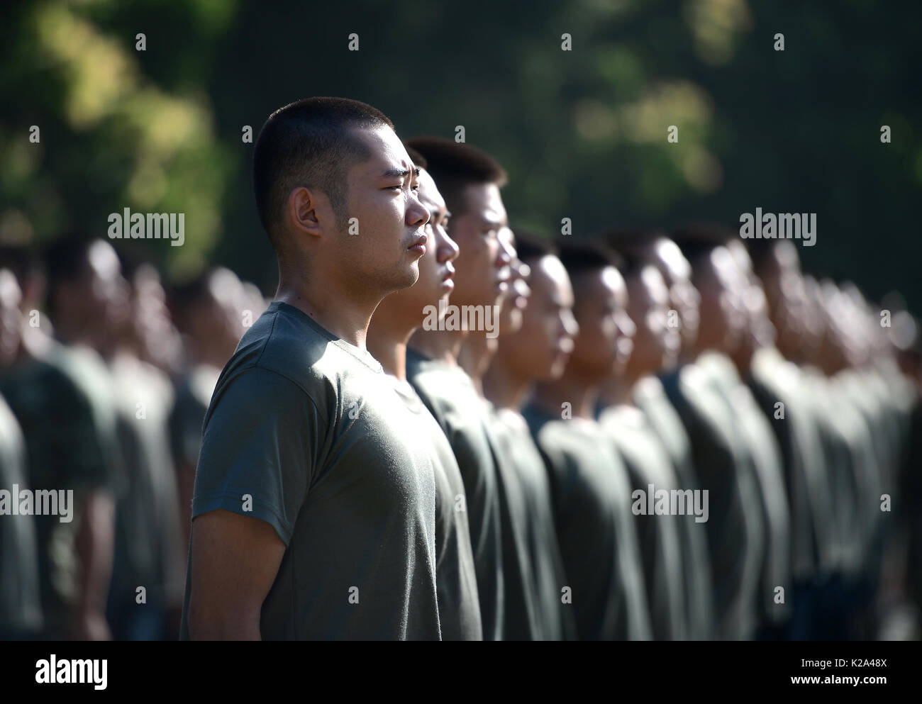 Liuzhou, China. 30th Aug, 2017. Deng Feng (front) takes part in a training for joining the army in Liuzhou, south China's Guangxi Zhuang Autonomous Region, Aug. 30, 2017. Deng, 24, who just graduated from Xingjian College of Science and Liberal Arts of Guangxi University, has signed for the army twice. When he was a freshman, Deng Feng was for the first time recruited as a soldier of Guangxi Frontier Corps of Chinese Armed Police and was on service for two years. Credit: Xinhua/Alamy Live News Stock Photo