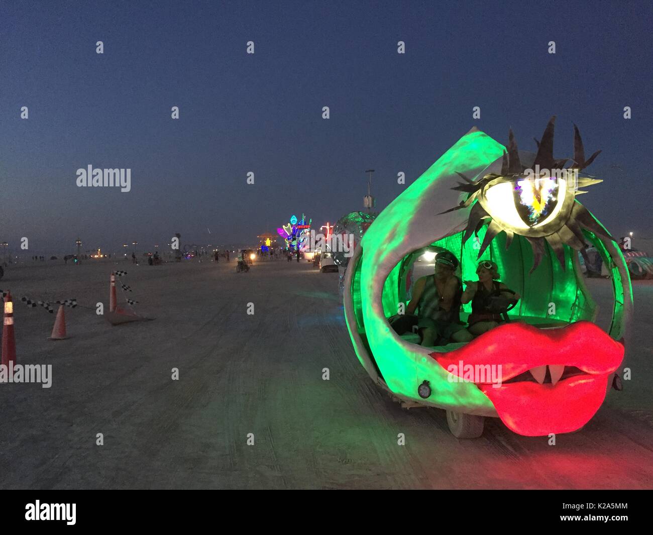 Mutant vehicles parade on the playa as the annual desert festival Burning Man August 28, 2017 in Black Rock City, Nevada. The annual festival attracts 70,000 attendees in one of the most remote and inhospitable deserts in America. Stock Photo