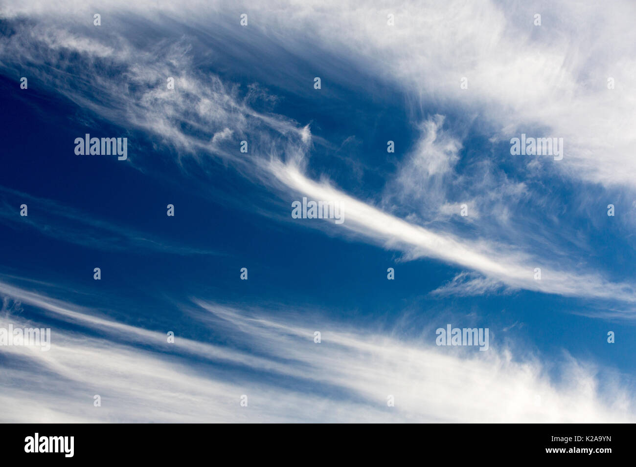 High Cirrus cloud, a sign of high winds in the upper atmosphere, over Cley, Norfolk, UK. Stock Photo